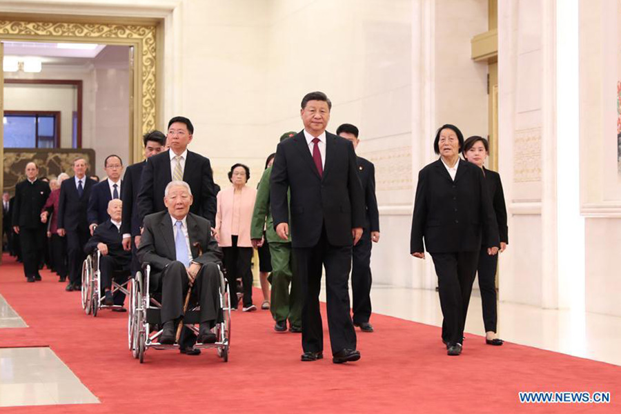 Xi confers highest state honors on individuals ahead of National Day