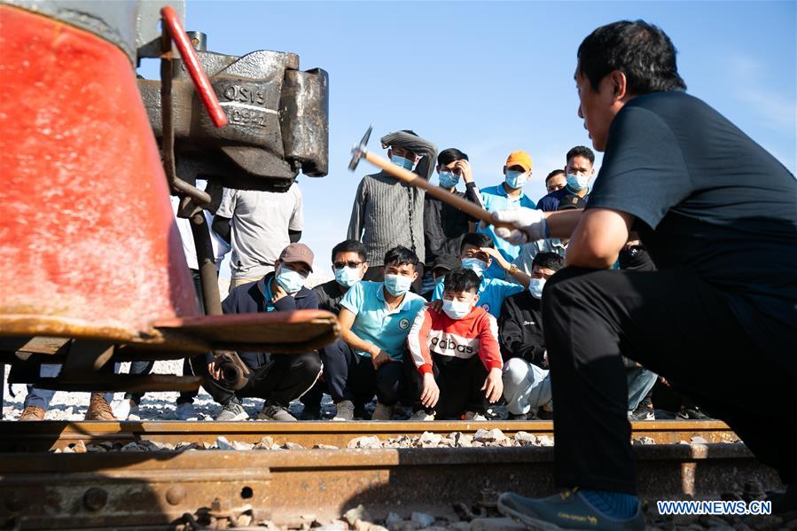 Lao train maintenance and driver trainees attend on-site teaching