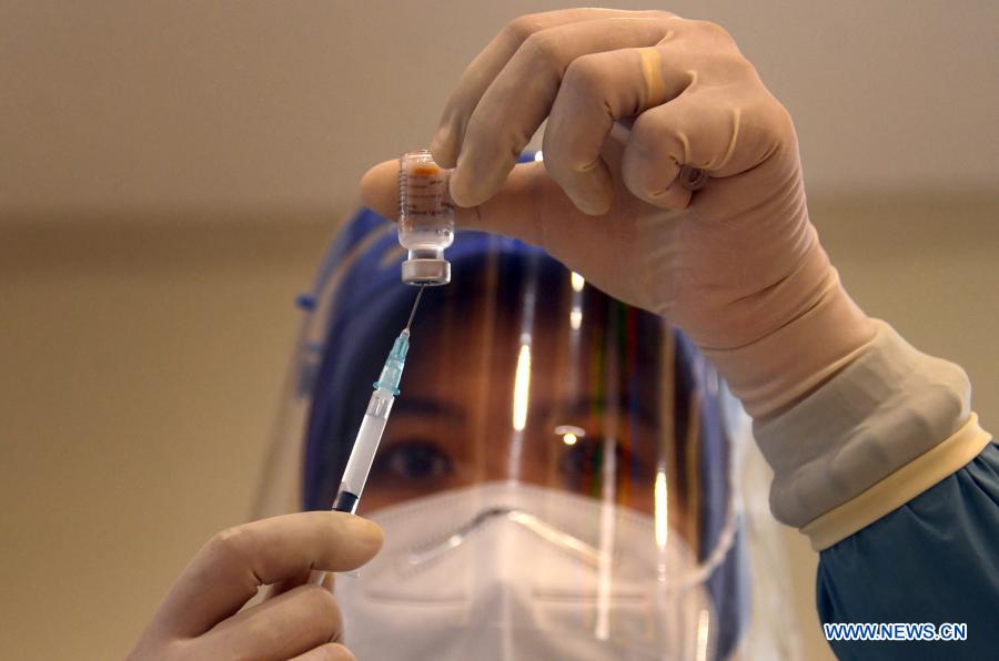 Health workers receive Sinovac COVID-19 vaccine from China in Surabaya, Indonesia