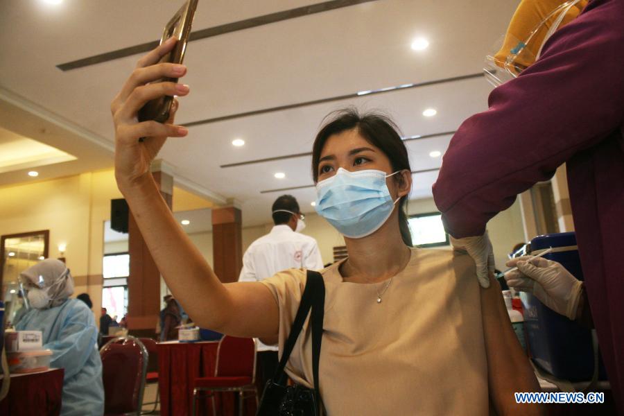 Health workers receive Sinovac COVID-19 vaccine from China in Surabaya, Indonesia