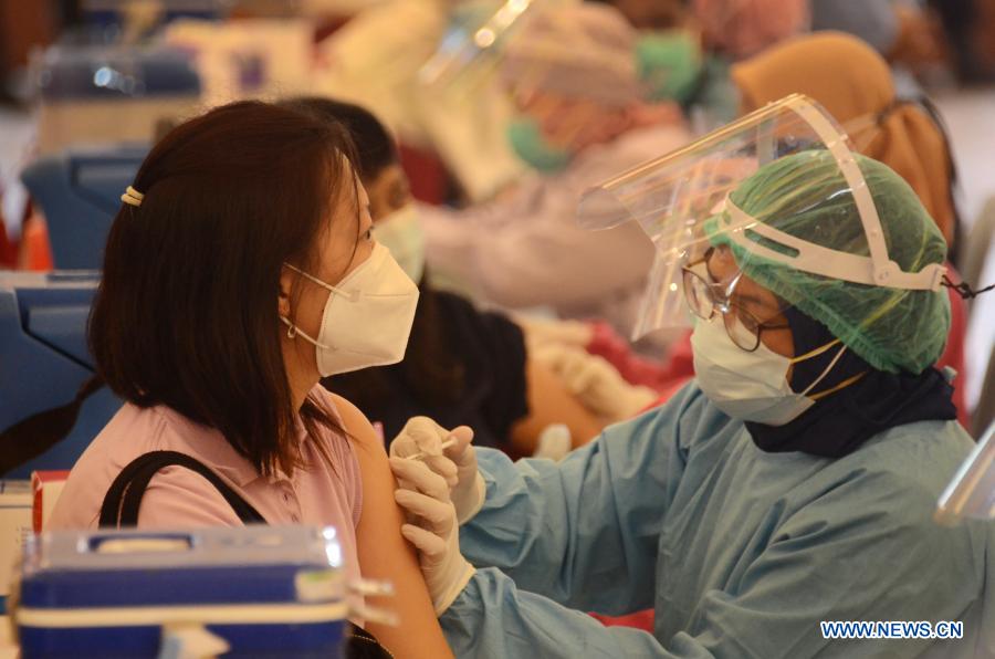 Health workers receive Sinovac COVID-19 vaccine from China in Surabaya, Indonesia