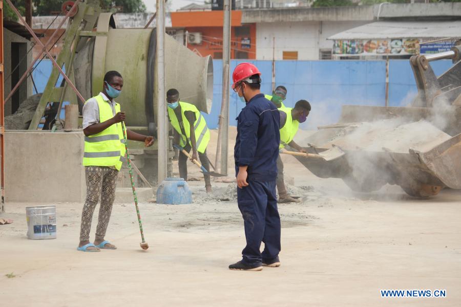 Beninese, Chinese workers work at renovation site of Friendship Stadium in Cotonou