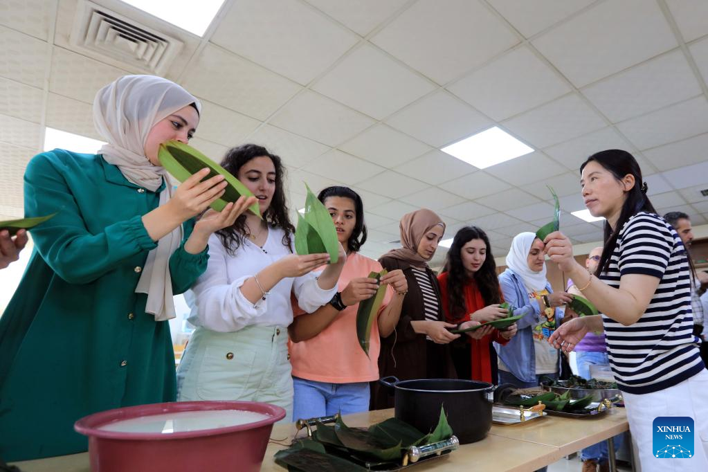 Students make Zongzi to celebrate Dragon Boat Festival in Amman, Jordan